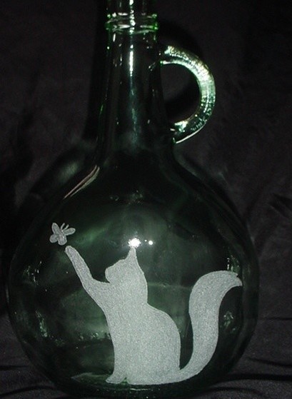 antique bottle with kitty