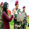 Cricketer M.S. Dhoni looks at the army jawans' training