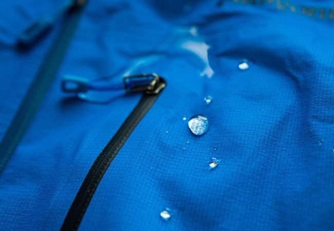 Water sliding off from textile jacket