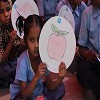 Girl child showing her drawing