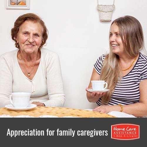 Senior-Woman-Drinking-Tea-with-Family-Caregiver