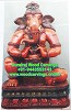 wooden ganesh statue playing tabla