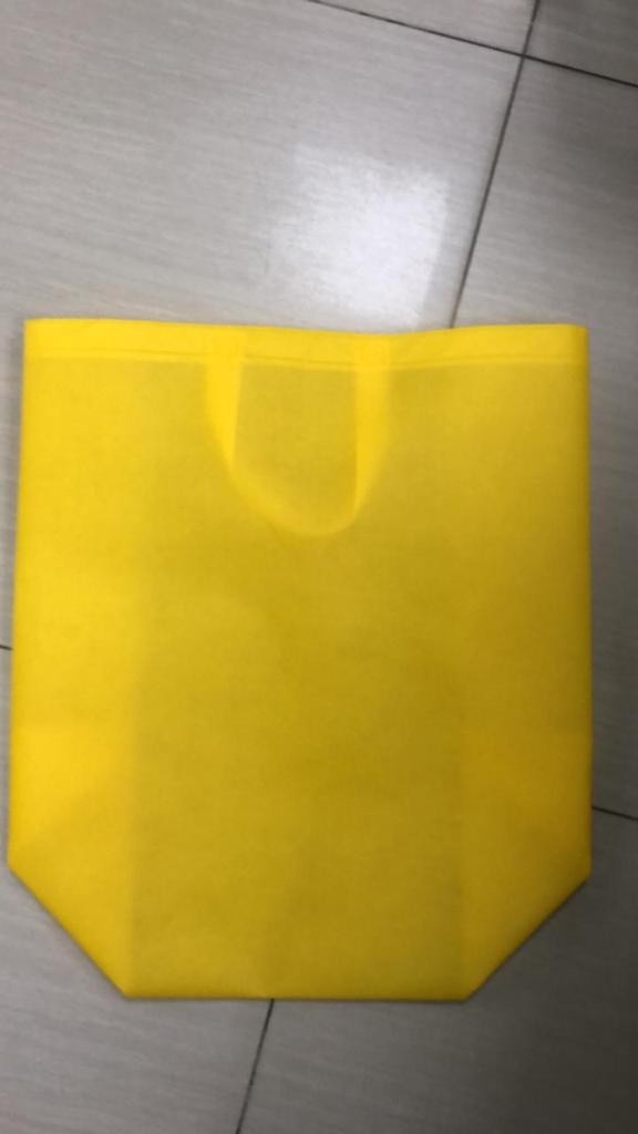 Buy custom designed non woven bags in Lahore in yellow colour at cheapest rate.