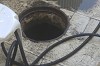 Opening a blockage in the sewer pipe