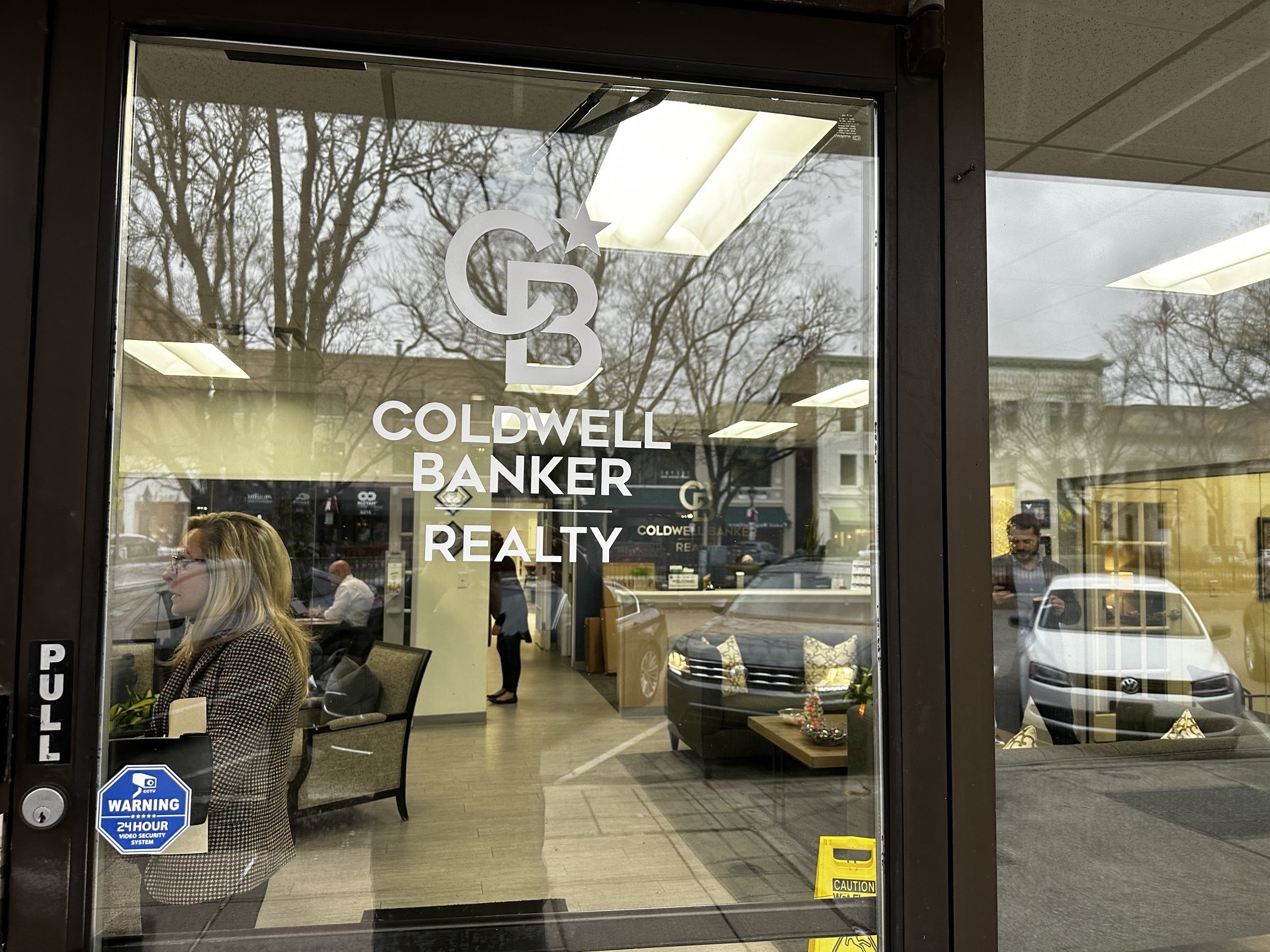 Signage on the front door at Hyde Park Cincinnati real estate agency Oyler Hines of Coldwell Banker