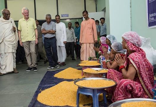 1.	Kitchen staff members greet Clinton with a traditional ‘Namaste’