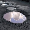 How are potholes created?