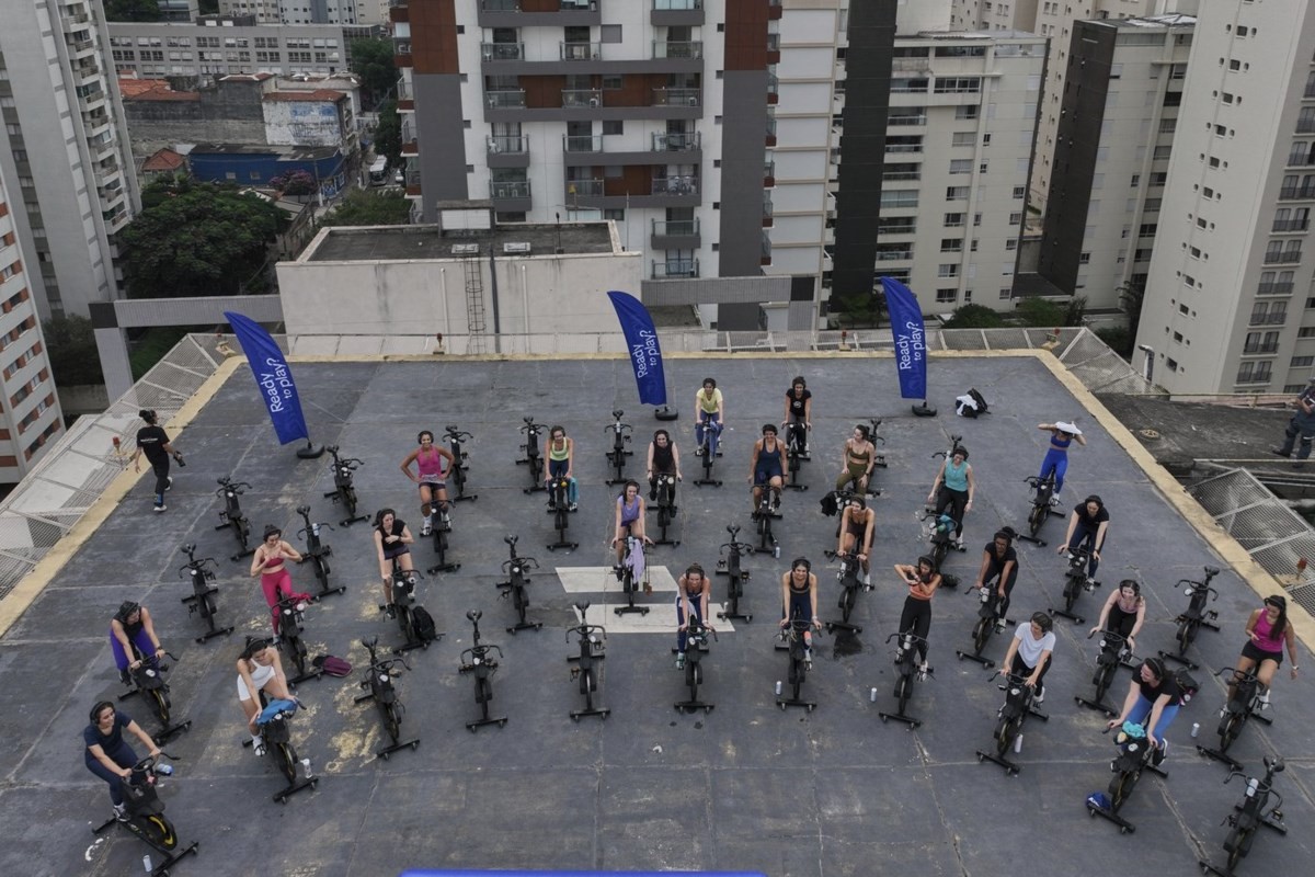 Up, up and spinning away. More Brazilians taking outdoor spin classes on helipads